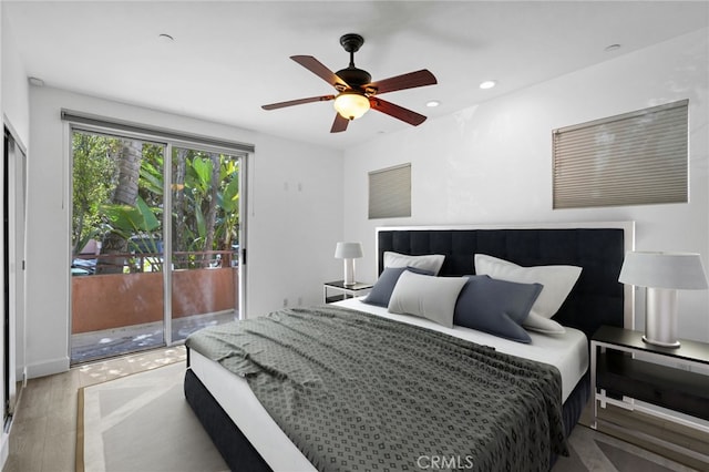 2010 S Beverly Glen Blvd Unit 103, Los Angeles, CA 90025 - bedroom featuring access to exterior, wood finished floors, recessed lighting, and ceiling fan