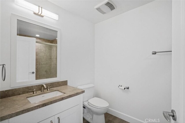 2010 S Beverly Glen Blvd Unit 103, Los Angeles, CA 90025 - full bathroom featuring vanity, a tile shower, and wood finished floors