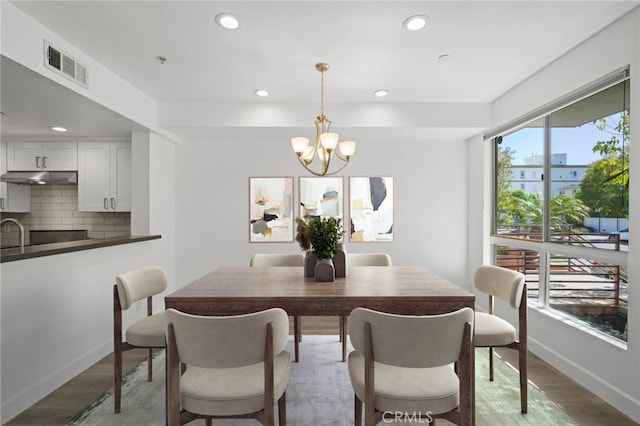 2010 S Beverly Glen Blvd Unit 103, Los Angeles, CA 90025 - dining space featuring a chandelier, light wood-style floors, and recessed lighting