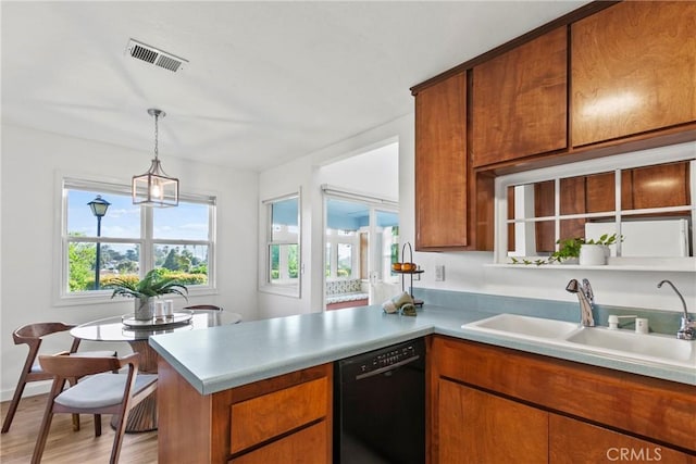 2892 Los Feliz Ct Unit 37, San Luis Obispo, CA 93401 - kitchen featuring black dishwasher, brown cabinets, and light countertops