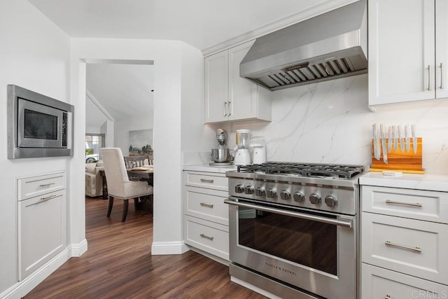 13655 Quinton Rd, San Diego, CA 92129 - kitchen featuring appliances with stainless steel finishes, wall chimney range hood, light countertops, tasteful backsplash, and dark wood-type flooring