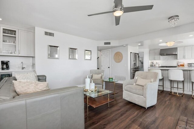13655 Quinton Rd, San Diego, CA 92129 - living room with dark wood finished floors, a ceiling fan, recessed lighting, and bar with sink