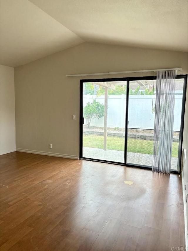 989 Ashton Ct, Vista, CA 92081 - empty room with vaulted ceiling and wood finished floors