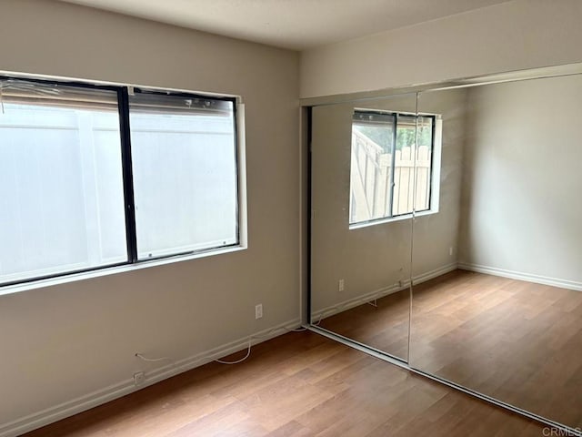 989 Ashton Ct, Vista, CA 92081 - unfurnished bedroom featuring wood finished floors and a closet