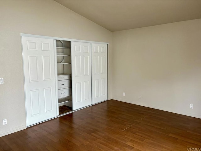 989 Ashton Ct, Vista, CA 92081 - unfurnished bedroom with dark wood-style floors, lofted ceiling, and a closet