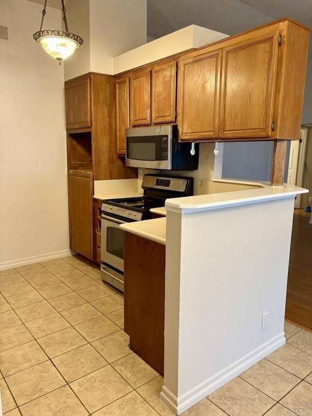 989 Ashton Ct, Vista, CA 92081 - kitchen featuring stainless steel appliances, light tile patterned floors, brown cabinetry, light countertops, and a peninsula