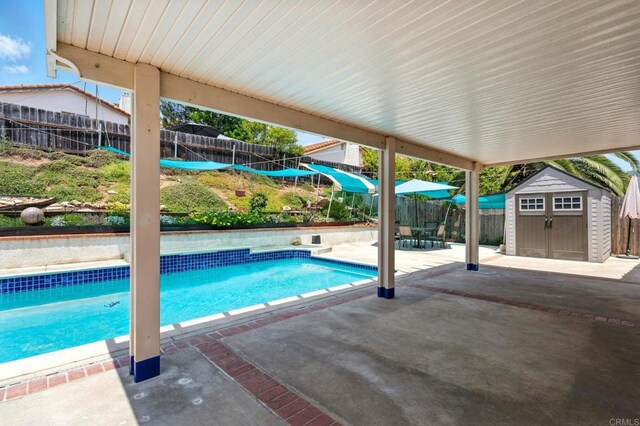 2760 Fieldbrook Way, Escondido, CA 92027 - view of swimming pool with a storage unit, a patio area, and a fenced backyard