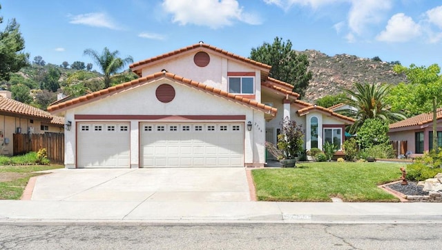 2760 Fieldbrook Way, Escondido, CA 92027 - mediterranean / spanish-style home with driveway, an attached garage, a tiled roof, and stucco siding