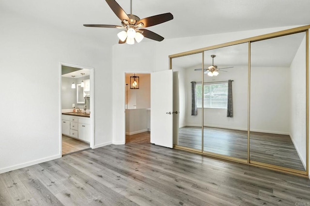 2760 Fieldbrook Way, Escondido, CA 92027 - unfurnished bedroom with vaulted ceiling, a closet, light wood-type flooring, ensuite bathroom, and a ceiling fan