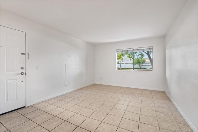 12191 Cuyamaca College Dr E Unit 213, El Cajon, CA 92019 - unfurnished room featuring light tile patterned flooring and baseboards