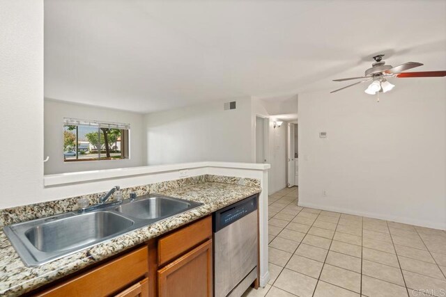 12191 Cuyamaca College Dr E Unit 213, El Cajon, CA 92019 - kitchen with dishwasher, light tile patterned floors, brown cabinets, and ceiling fan