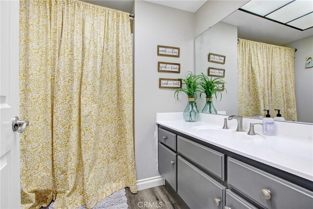 1964 Baseline Rd, La Verne, CA 91750 - bathroom featuring wood finished floors, vanity, and curtained shower