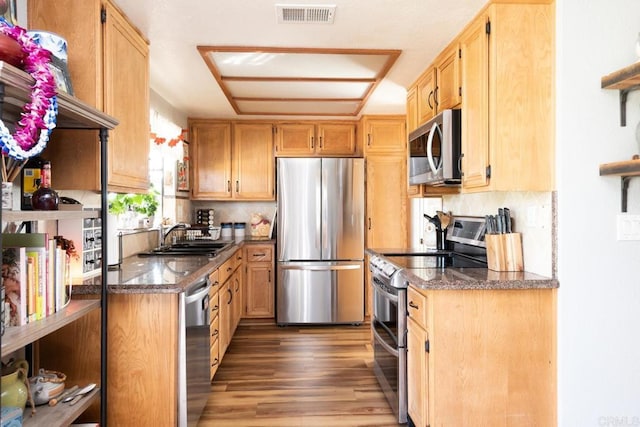 11705 Via Medanos, San Diego, CA 92128 - kitchen featuring stainless steel appliances, light wood-style floors, decorative backsplash, and dark stone counters