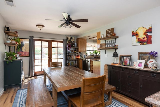 11705 Via Medanos, San Diego, CA 92128 - dining area with french doors, ceiling fan, and light wood finished floors