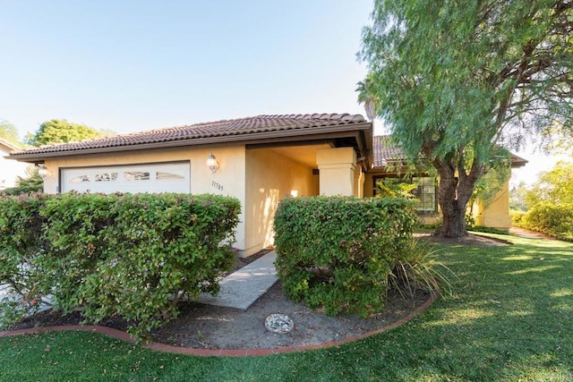 11705 Via Medanos, San Diego, CA 92128 - mediterranean / spanish house with a tile roof, a front yard, stucco siding, and a garage