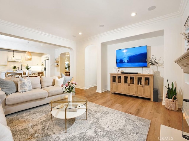 29 Via Timon, San Clemente, CA 92673 - living area with light wood-style floors, arched walkways, crown molding, and recessed lighting