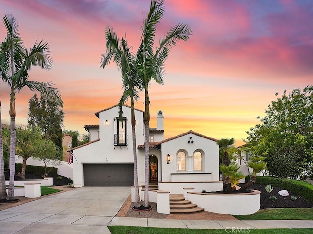 29 Via Timon, San Clemente, CA 92673 - mediterranean / spanish-style home featuring an attached garage, concrete driveway, and stucco siding