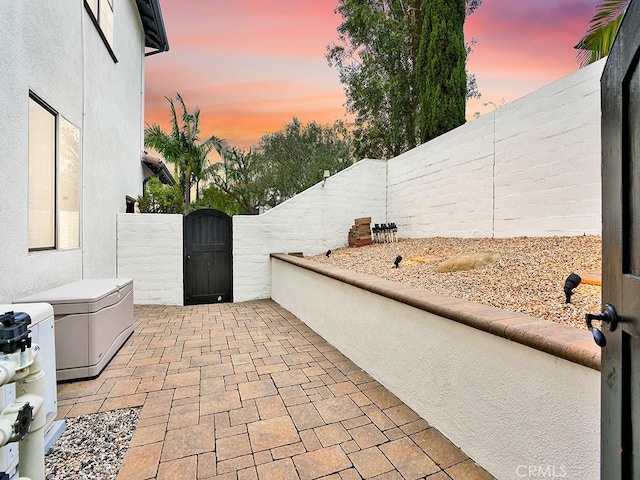 29 Via Timon, San Clemente, CA 92673 - patio terrace at dusk with a gate, a fenced backyard, and a patio