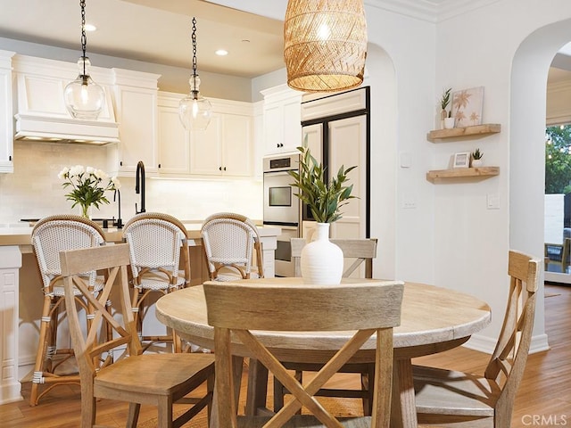 29 Via Timon, San Clemente, CA 92673 - dining space featuring arched walkways, light wood-style floors, and recessed lighting