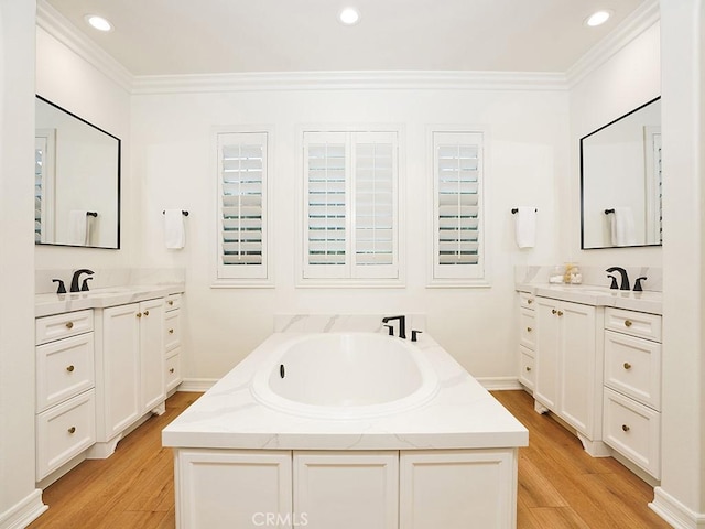 29 Via Timon, San Clemente, CA 92673 - bathroom with crown molding, two vanities, wood finished floors, a garden tub, and recessed lighting