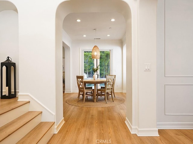 29 Via Timon, San Clemente, CA 92673 - dining room with arched walkways, light wood-style flooring, recessed lighting, stairway, and ornamental molding