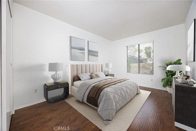 25644 Mont Pointe Unit 1A, Lake Forest, CA 92630 - bedroom featuring dark wood-type flooring and a textured ceiling