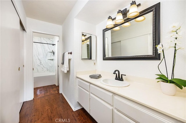 25644 Mont Pointe Unit 1A, Lake Forest, CA 92630 - bathroom featuring wood finished floors, vanity, and shower / bath combo