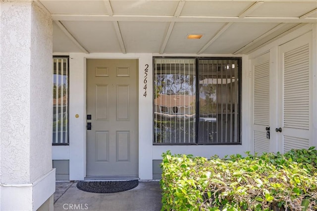 25644 Mont Pointe Unit 1A, Lake Forest, CA 92630 - doorway to property featuring stucco siding