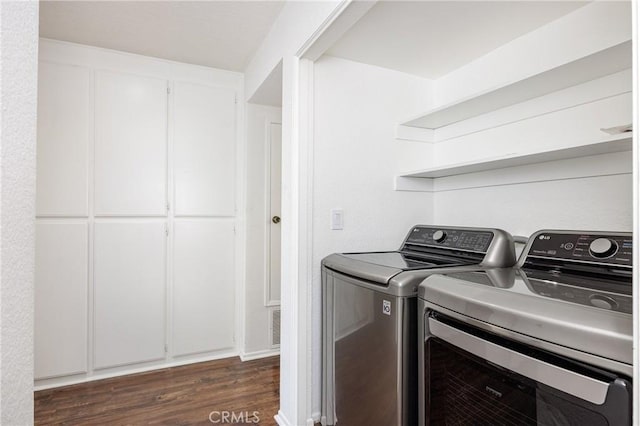 25644 Mont Pointe Unit 1A, Lake Forest, CA 92630 - washroom featuring washing machine and dryer and dark wood-style flooring