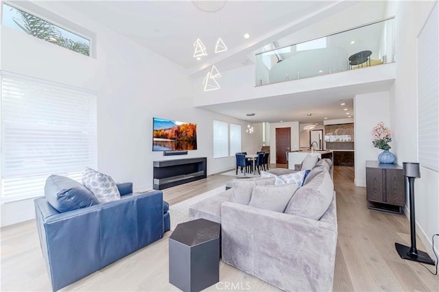 615 El Redondo Ave, Redondo Beach, CA 90277 - living room with a towering ceiling and light wood-style flooring