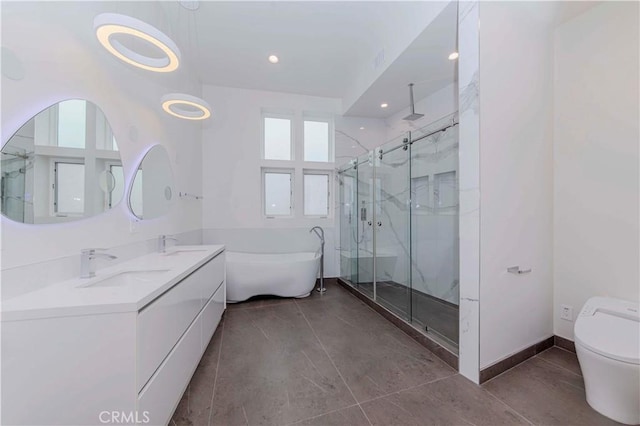 615 El Redondo Ave, Redondo Beach, CA 90277 - full bathroom with a marble finish shower, a freestanding bath, double vanity, and recessed lighting