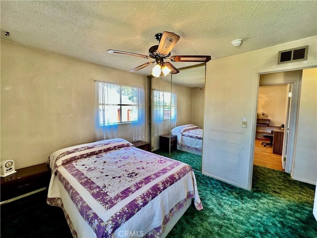8675 Colorado Ave, Riverside, CA 92504 - carpeted bedroom featuring a closet, a textured ceiling, and ceiling fan