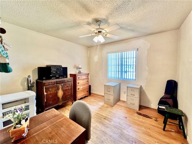 8675 Colorado Ave, Riverside, CA 92504 - office space featuring light wood-style flooring, ceiling fan, and a textured ceiling