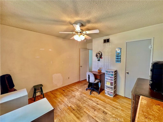 8675 Colorado Ave, Riverside, CA 92504 - office featuring a ceiling fan, a textured ceiling, and light wood finished floors
