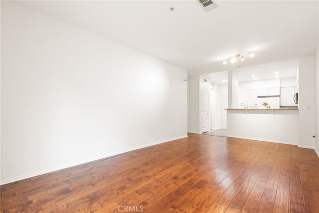 6400 Crescent E Unit 121, Playa Vista, CA 90094 - unfurnished living room with dark wood finished floors and baseboards