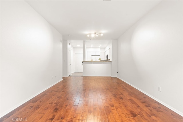 6400 Crescent E Unit 121, Playa Vista, CA 90094 - unfurnished living room with wood-type flooring and baseboards