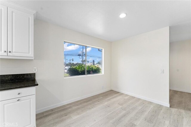 558 W Philadelphia St, Ontario, CA 91762 - unfurnished dining area featuring light wood finished floors and recessed lighting
