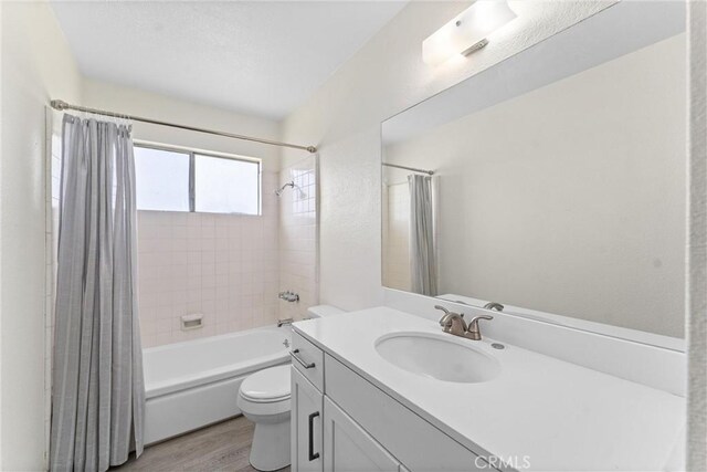558 W Philadelphia St, Ontario, CA 91762 - full bath with shower / bathtub combination with curtain, vanity, and wood finished floors