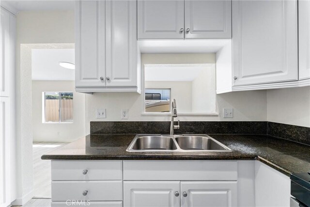 558 W Philadelphia St, Ontario, CA 91762 - kitchen featuring white cabinets, range, and dark stone countertops