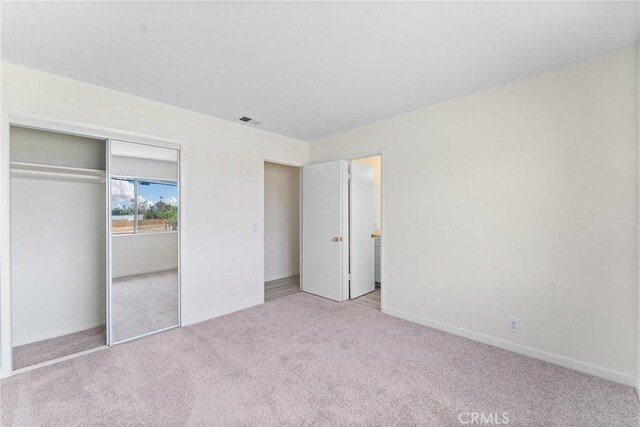 558 W Philadelphia St, Ontario, CA 91762 - unfurnished bedroom featuring carpet and a closet