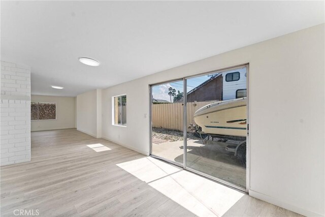 558 W Philadelphia St, Ontario, CA 91762 - spare room featuring wood finished floors and baseboards