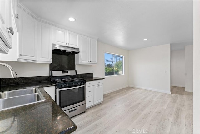 558 W Philadelphia St, Ontario, CA 91762 - kitchen featuring gas range, under cabinet range hood, white cabinetry, light wood-style floors, and recessed lighting