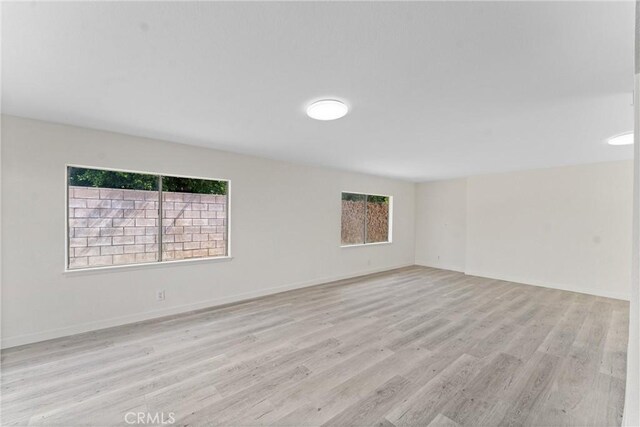 558 W Philadelphia St, Ontario, CA 91762 - unfurnished room with light wood finished floors and baseboards