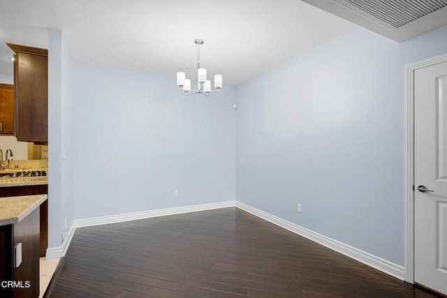 4424 Whitsett Ave Unit 102, Studio City, CA 91604 - unfurnished dining area featuring dark wood-style flooring and a chandelier