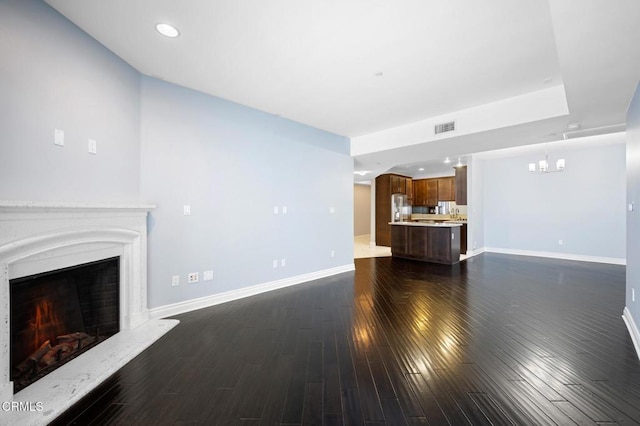 4424 Whitsett Ave Unit 102, Studio City, CA 91604 - unfurnished living room with a lit fireplace, dark wood-style flooring, a chandelier, and recessed lighting