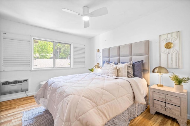 6660 Bell Bluff Ave Unit A, San Diego, CA 92119 - bedroom with wood finished floors, a wall mounted air conditioner, and a ceiling fan