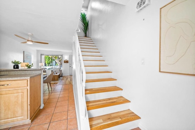 6660 Bell Bluff Ave Unit A, San Diego, CA 92119 - stairs featuring a ceiling fan and tile patterned floors