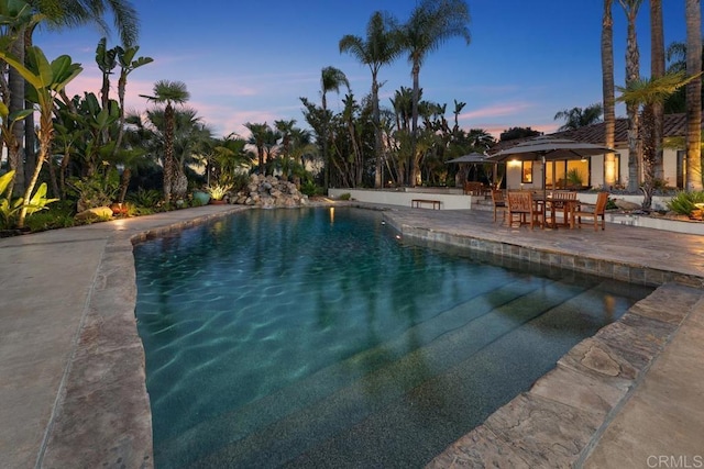 9 Rolling View Ln, Fallbrook, CA 92028 - pool at dusk featuring a patio area and an outdoor pool