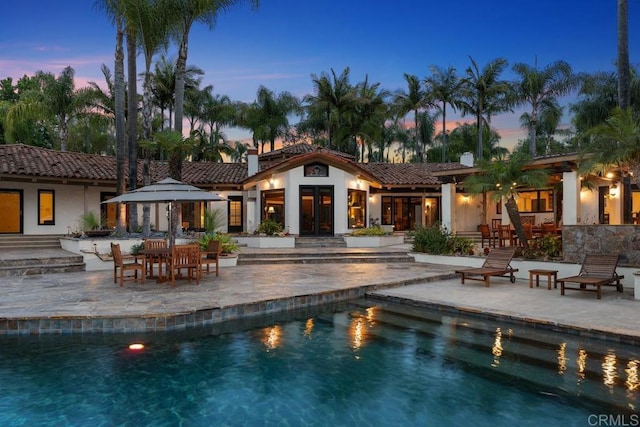 9 Rolling View Ln, Fallbrook, CA 92028 - pool at dusk featuring a patio area and an outdoor pool