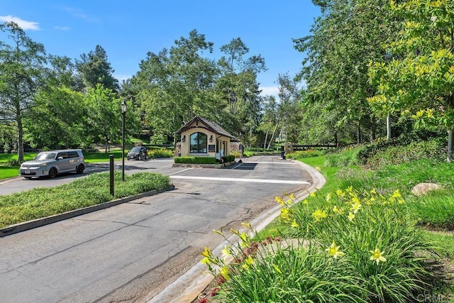 9 Rolling View Ln, Fallbrook, CA 92028 - view of asphalt road with curbs, view of scattered trees, and street lighting